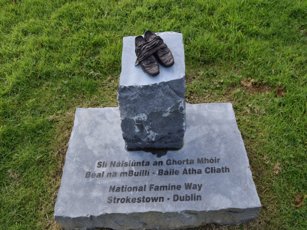 Bronze-Shoes-at-Mosstown-Harbour-representing-The-National-Famine-Way null